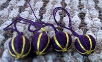 Part of a set of 12 thread wrapped buttons I donated as a personal gift at Caid's Crown tourney to HRM Bridget Lucia Mackenzie along with sets of three more but smaller buttons. Using the same technique as Lady Muirgein's buttons. Photo by Maile.