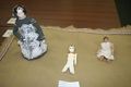 Jointed dolls: late-period fashion doll with moving arms, Coptic bone doll, and Greek jointed doll